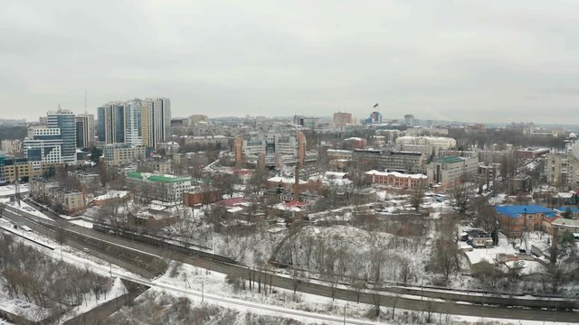 Bird's eye view from drone on winter cityscape of downtown area of Dnipro city. 4k video footage from quadcopter. (Dnepr, Dnepropetrovsk, Dnipropetrovsk). Ukraine