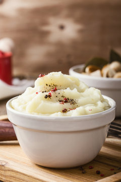 Mashed potatoes on wooden table, vegetarian meal