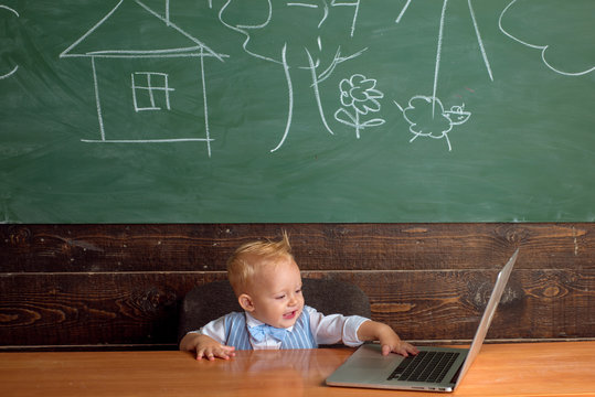 Little Boy Use Free Internet In Computer Class. Preschooler Have Access To Wireless Internet Connection In School Classroom