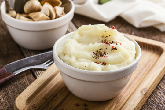 Mashed potatoes on wooden table, vegetarian meal