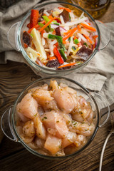Raw chicken fillet breast cut into pieces.