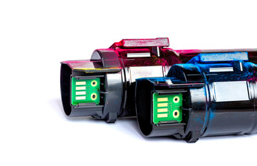 Toner cartridge set for color laser printer. Microcircuits. Equipment for printingon white background.