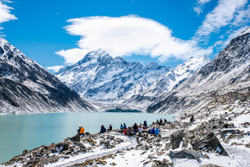 Fototapeta premium 2018, Oct 13, New Zealand, Mount Cook National Park, Group of traveler enjoying with a beautiful view covered with snow after a snowy day.