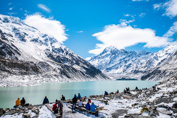 2018, Oct 13, New Zealand, Mount Cook National Park, Group of traveler enjoying with a beautiful view covered with snow after a snowy day.