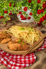 Chicken nuggets with yellow beans.