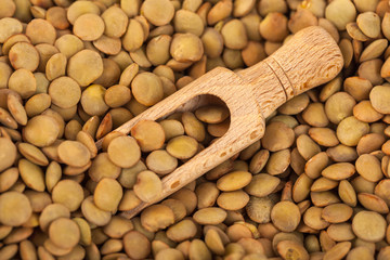 dry lentils on wooden spoon, healthy food