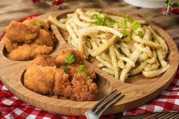 Chicken nuggets with yellow beans.