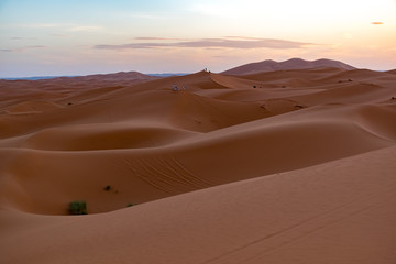 Fototapeta na wymiar Beautiful colorful sunset in Erg Chebbi Dunes, Sahara Desert, Merzouga, Morocco, Africa