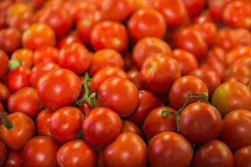 Pile of tomatoes background.
