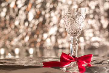Crystal glass. Transparent crystal glass. Empty glass.  Blurred lights or bokeh lights