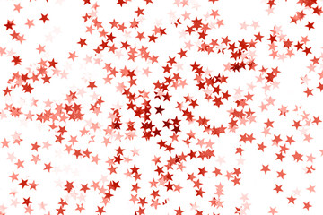 Stars confetti toned Living Coral color isolated on white background.
