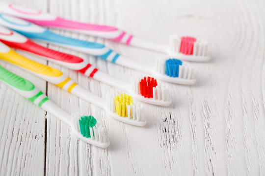 many colorful toothbrushes