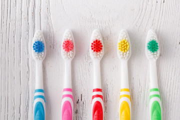 many colorful toothbrushes