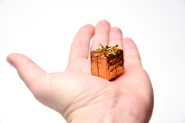 Shiny little gift in hand