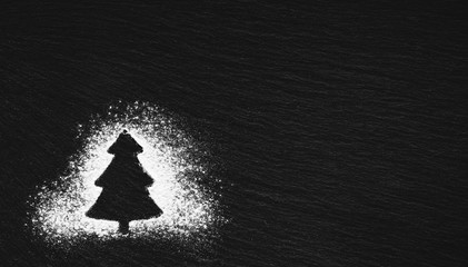 silhouette of a Christmas tree drawn with white flour