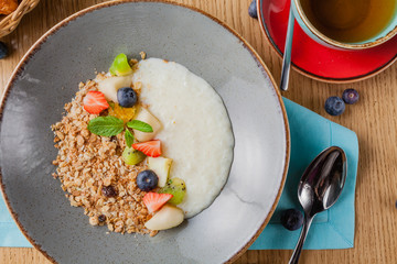 Rice porrige with strawberry on breakfast in cafe