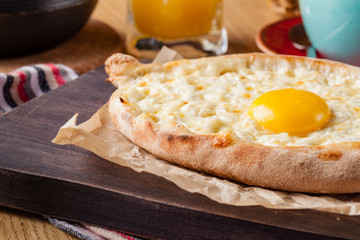 Khachapuri - traditional tortillas with eggs of Georgian cuisine. Served with spices instead of bread. Eastern food