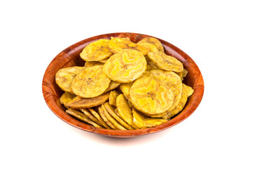 Pile of crunchy sliced dehydrated plaintain fruit chips