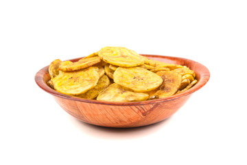 Pile of crunchy sliced dehydrated plaintain fruit chips