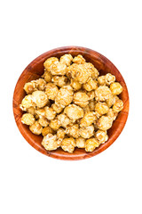 Handfuls of caramel popped popcorn kernels