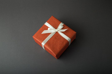 Gift box on a dark background. Top view with place for text