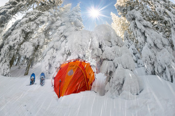 winter landscape with a tent after a storm