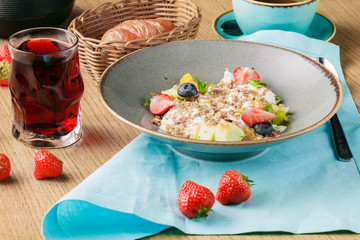 Breakfast concept, Oatmeal and fresh fruits in dish