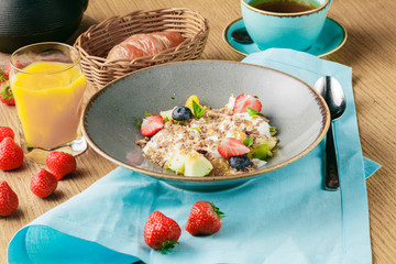 continental breakfast in a cafe, oatmeal with berries
