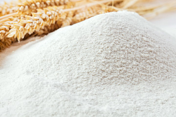 heap of flour with ears of wheat