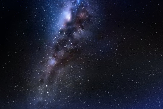 Space background with night starry sky and Milky Way. Dark blue nebula