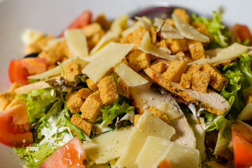 salad with cheese and baked crackers and with tomatoes