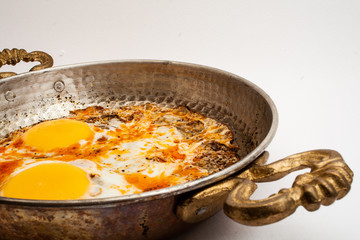 eggs in copper pan