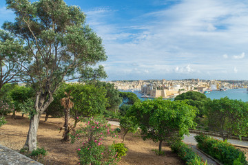 Fototapeta na wymiar Herbert Ganado Gardens, Floriana with the city of Senglea in the background.