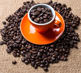 Brown roasted coffee beans, seed on dark background. Espresso dark, aroma, black caffeine drink. Closeup isolated energy mocha, cappuccino ingredient.