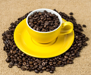 Brown roasted coffee beans, seed on dark background. Espresso dark, aroma, black caffeine drink. Closeup isolated energy mocha, cappuccino ingredient.