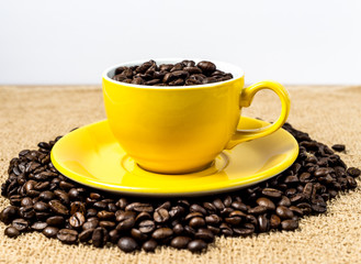 Brown roasted coffee beans, seed on dark background. Espresso dark, aroma, black caffeine drink. Closeup isolated energy mocha, cappuccino ingredient.