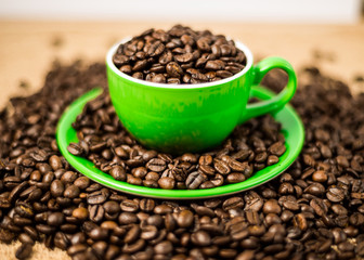Brown roasted coffee beans, seed on dark background. Espresso dark, aroma, black caffeine drink. Closeup isolated energy mocha, cappuccino ingredient.