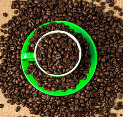 Brown roasted coffee beans, seed on dark background. Espresso dark, aroma, black caffeine drink. Closeup isolated energy mocha, cappuccino ingredient.
