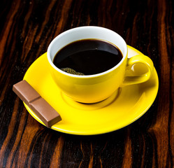 Brown roasted coffee beans, seed on dark background. Espresso dark, aroma, black caffeine drink. Closeup isolated energy mocha, cappuccino ingredient.