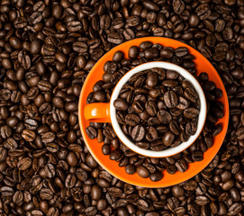 Brown roasted coffee beans, seed on dark background. Espresso dark, aroma, black caffeine drink. Closeup isolated energy mocha, cappuccino ingredient.