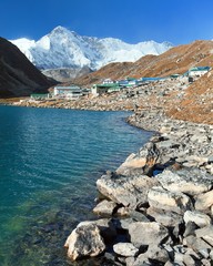 View of Gokyo lake and village with mount Cho Oyu