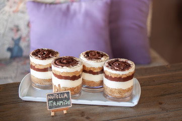 Chocolate tiramisu jar cakes on white plate