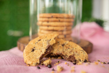 Chocolate cookie on wood on pink sack fabric
