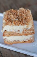 Mille-feuille is known vanilla or custard slice on white plate