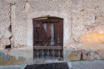 old door, ornated stone wall
