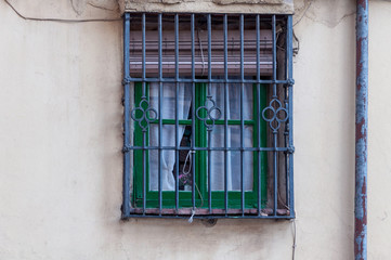 window with ornated iron grid