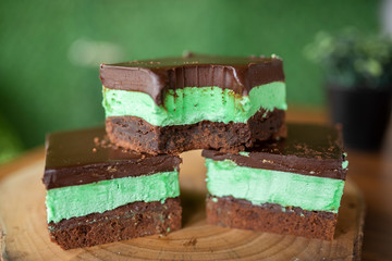 Mint brownies on wood with green background