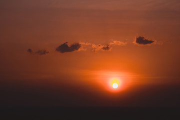 Scenic orange sunset sky background, scenic orange sunrise, relaxing seascape with wide horizon.
