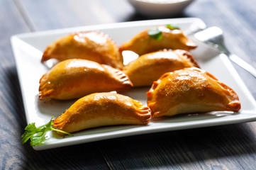 Empanada  -dumplings stuffed with meat and vegetable.