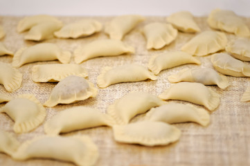 Fototapeta na wymiar Preparation of dumplings - delicate cakes